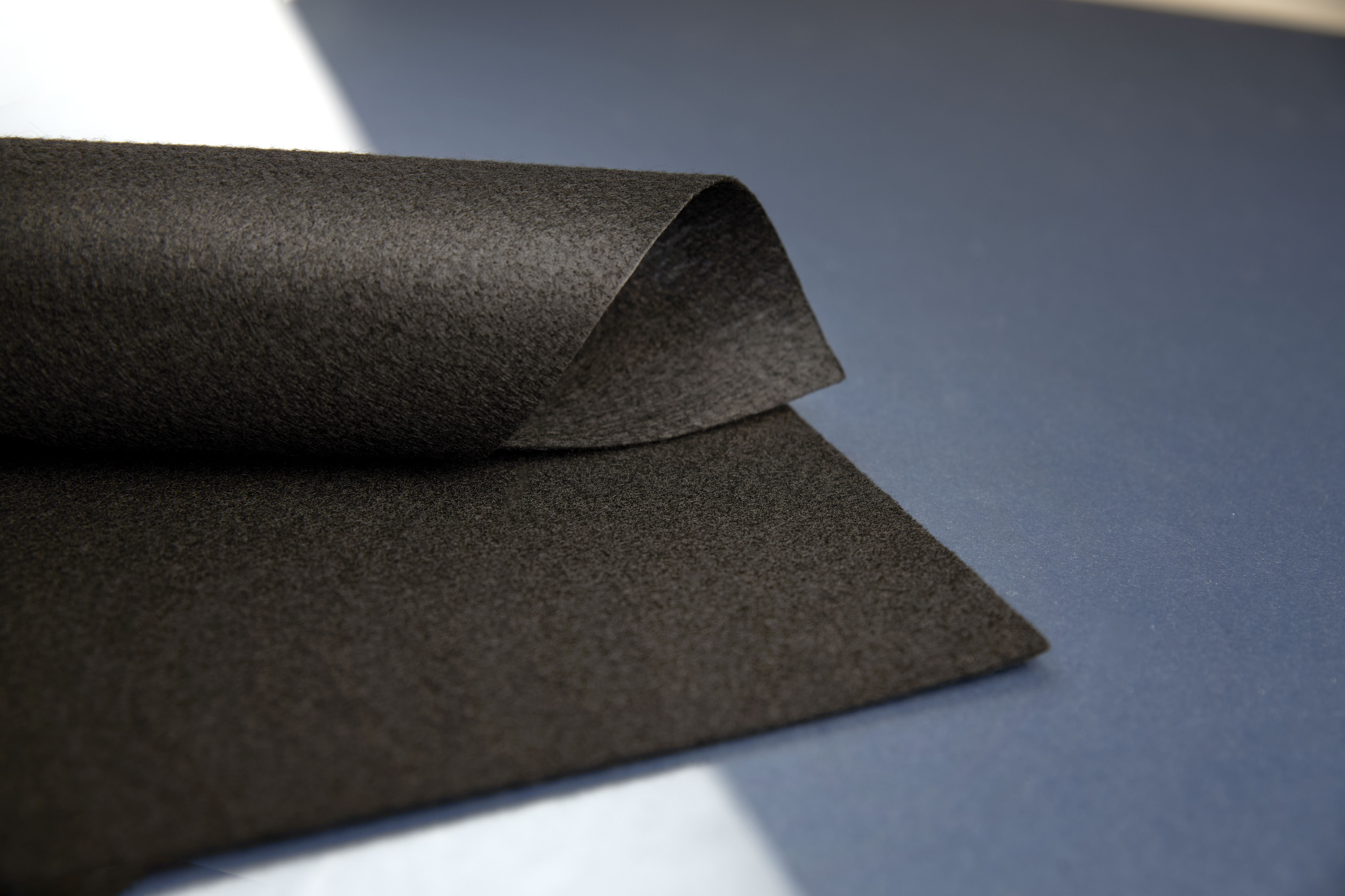 Luggage compartment lining materials