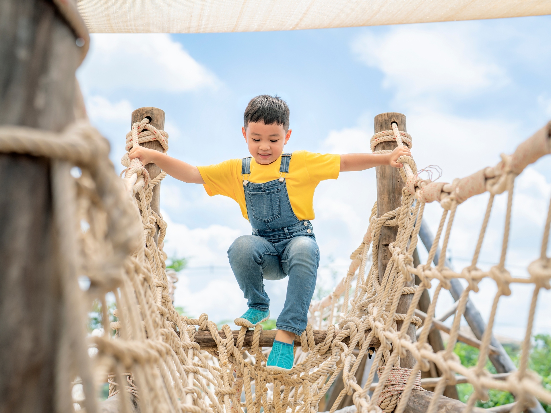 stock-photo-asian-boy-play-slider-toy-in-playground-in-he-preschool-school